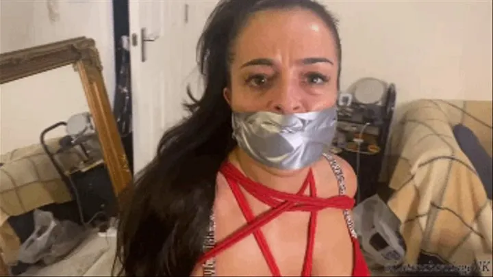 Latina tied up and gagged with a tape wrap