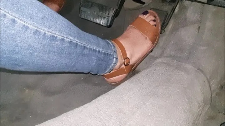 Brown sandals driving