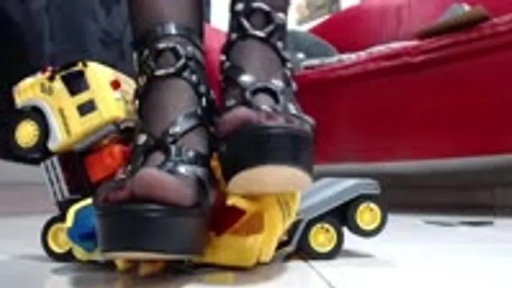 crush a truck with excavator in nylons wearing heels and wooden sandals