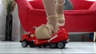 crushing the super red Montoy Toy Truck with wooden Sam Edelman sandals and Nylons