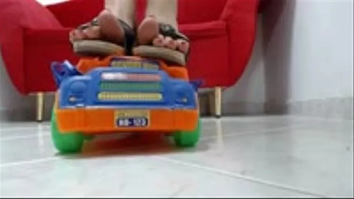 crushing a Big Toycar Bus barefeet and in Berkemann wooden sandals