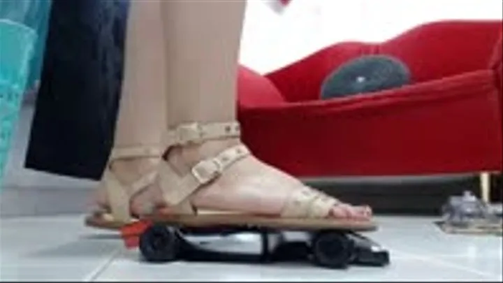 crush a F1 toy car with gladiator buckled and wooden sandals