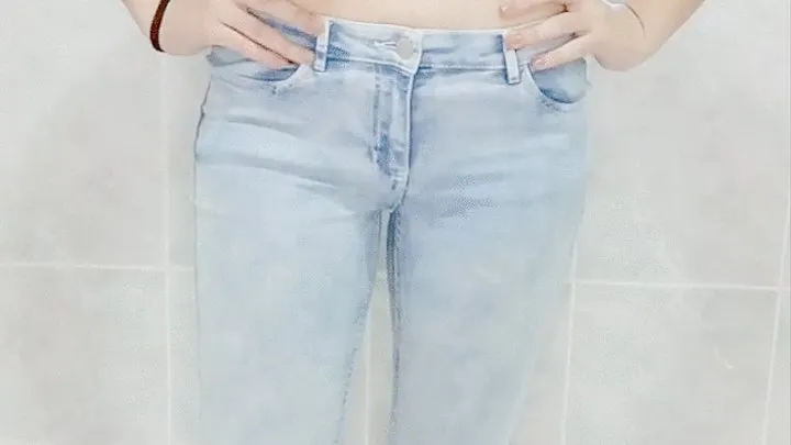 Watch this young woman enjoy pissing her jeans for the first time in the bathtub