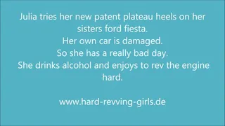 Julia revving hard Ford Fiesta in patent plateau high heels