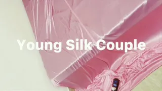 Girl tied on bed in shiny soft pink silk (Part 1)