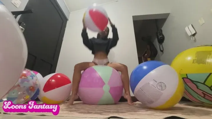 Akina sit to pop beach balls( )