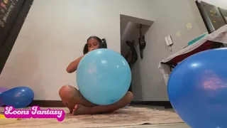 Akina blowing up bunch of blue balloons