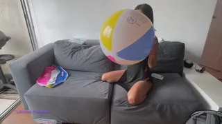 Akina blows up and pops beach ball