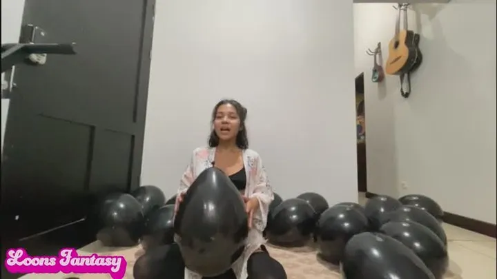 Akina pops black balloons