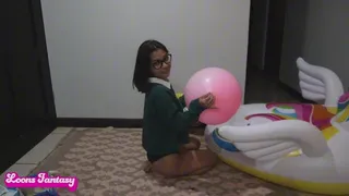 Akina pops a huge pink balloon