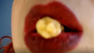 My red lips play with the popcorn