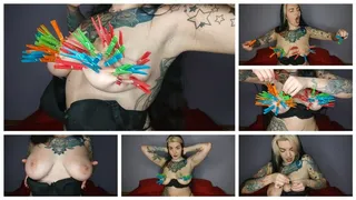 Tattooed, kinky girl hangs the maximum number of clothespins on her big tits