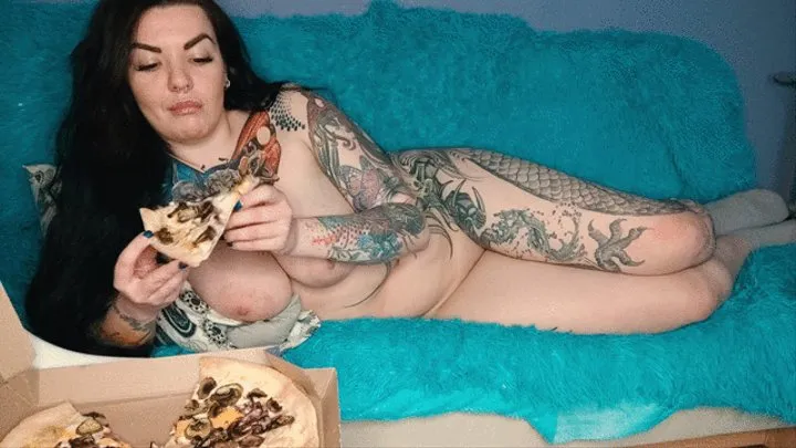 Tattooed, busty and sexy girl with long hair farts and eats pizza