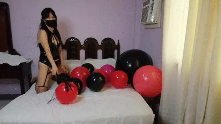 Dominatrix punishes balloons