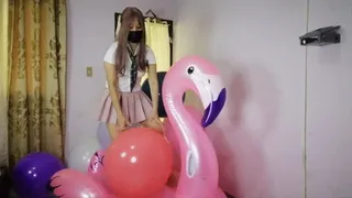 Popping 18 inch balloons on inflatable