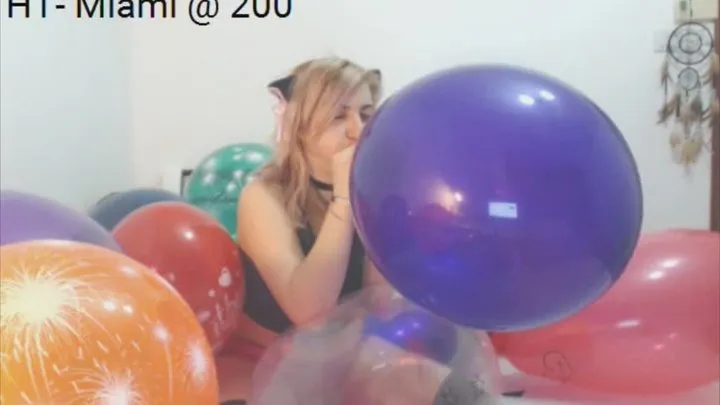 Blow to Pop Surrounded by Balloons