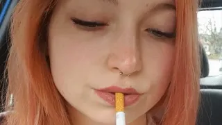 Sweet redhead smoking in car
