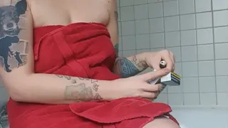 Sitting on the Bathtub just with a towel and enjoy Smoking