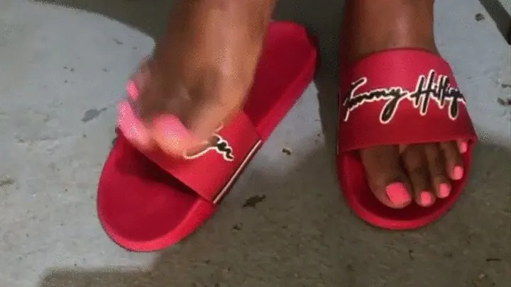 Sexy feet in red flip flops