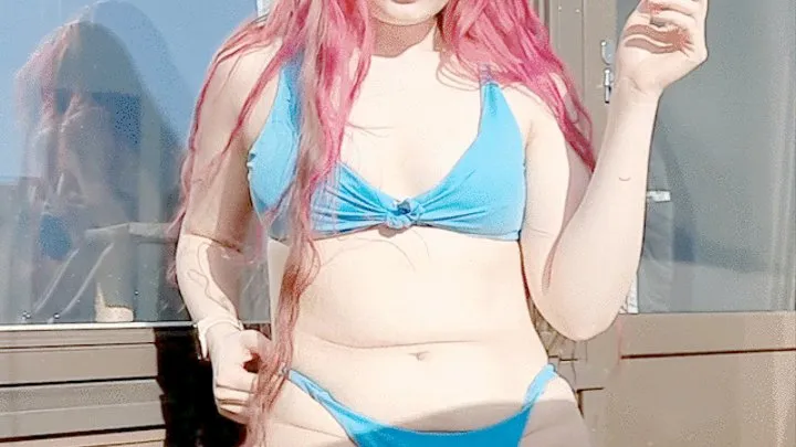 Smoking in a blue bikini