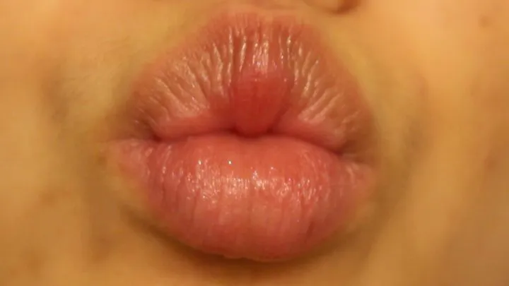 Aurora Puckers and Pulses Her Lips