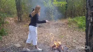 Tearing and burning clothes in the woods