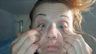 A woman plucks out her eyes (eye test)