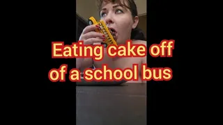 Eating cake off of bus