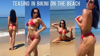 Teasing in bikini on the beach