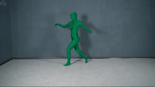 Green man in zentai in transparent vacuum bed with flips and vibration