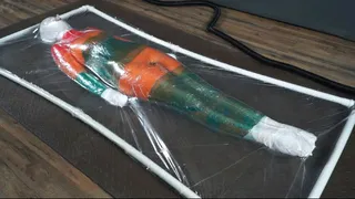 Mummification with multicolored stretch wrap in a transparent vacuum bed with vibro and orgasms