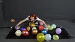 Sonya balloons in a black latex bed