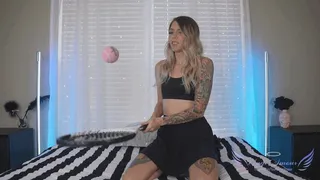 Sporty girl blows up balloons