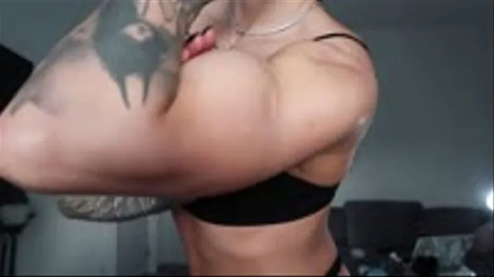 Fit girl feeding her muscle with white eggs and flexing her big biceps