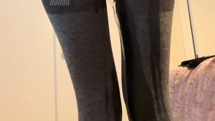 pissing in tight gray leggings