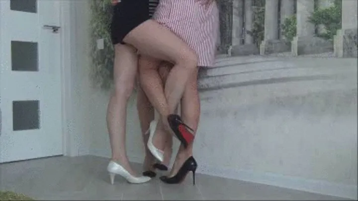 Sensual footsie in sexy high heels