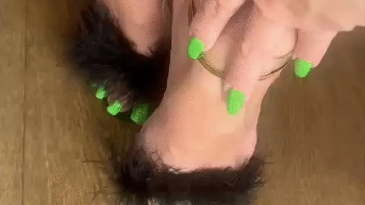 Bright green long toenails