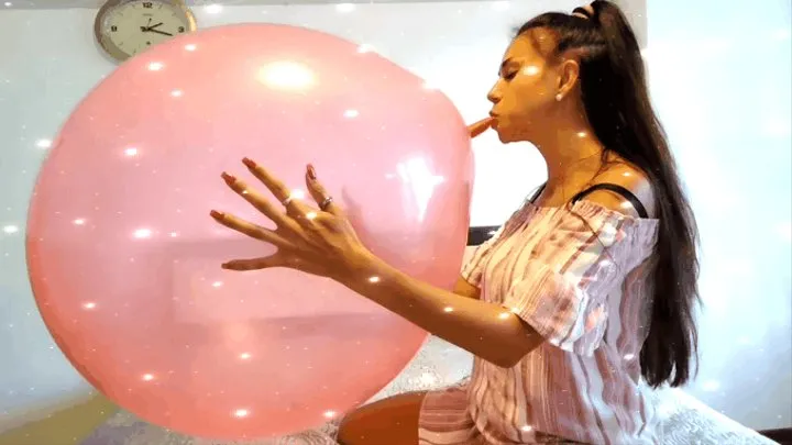 A huge pink balloon turns into shreds