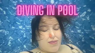 in pool blowing bubbles