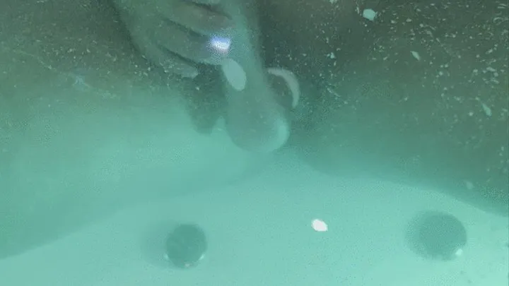 Jasmine masturbates her clitoris with a waterproof sex toy in the jaccuzy