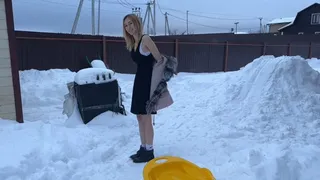 A girl in the -20 frost walks in a light dress and barefoot, she rides down a snow slide (reissue)