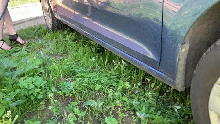 sexy young Alena washes a car in high heels, which are buried in foam and mud