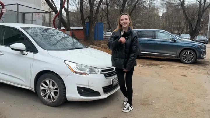 girl rocks the car suspension and the car shakes