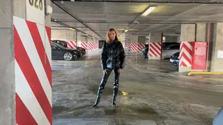 girl in high-heeled leather boots likes to press the pedals in cars, changes two cars and presses the pedals in them with a dash