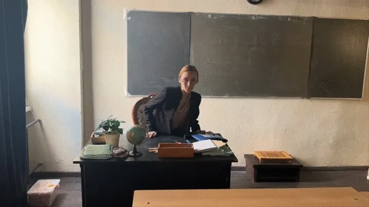 teacher explains the topic to the class and plays with his high heels (re-release)