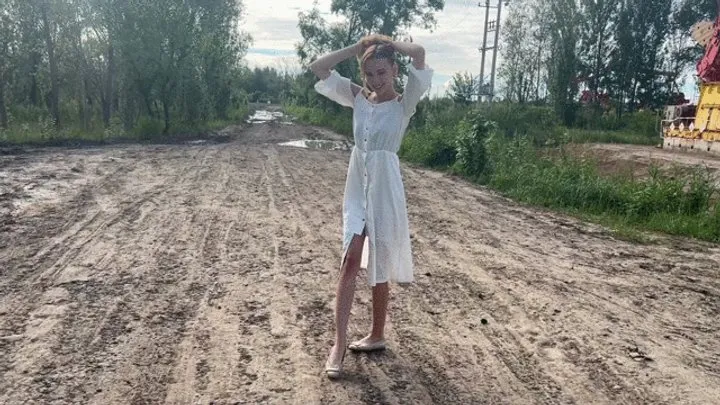 A girl in ballet flats walks through deep and slimy mud, slipping and getting stuck in it (re-realize)