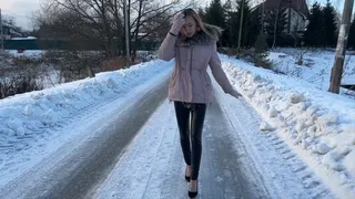 girl walked up the icy mountain in high heels, her heel slipped and she injured her leg