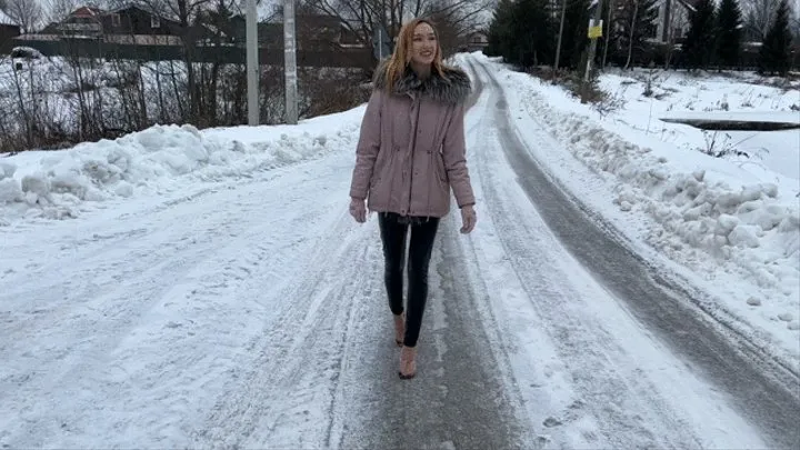 girl in high-heeled sandals always slips on an icy mountain and falls