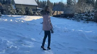 girl walks on ice in high heels and slips