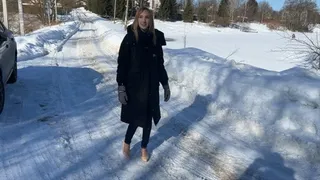 girl in high-heeled shoes and straps climbs an ice slide, falls and twists her foot, now she can't walk